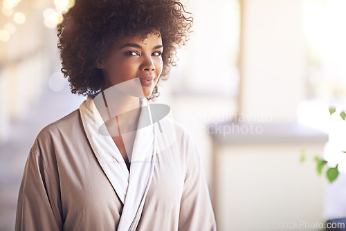 Image of Spa, woman and portrait with skincare in a bathrobe for wellness, cosmetics and beauty treatment. Health, relax and resort with an African female person ready for dermatology at a hotel bathroom