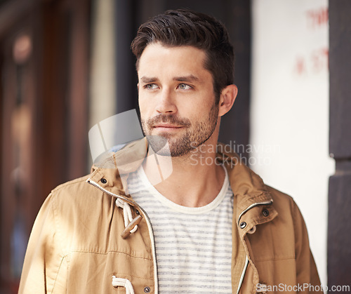 Image of Man, face or serious in city with fashion by cafe with urban style, trendy outfit and confidence or pride. Male person, thinking or relax outdoor in town with wellness, casual clothes or morning trip