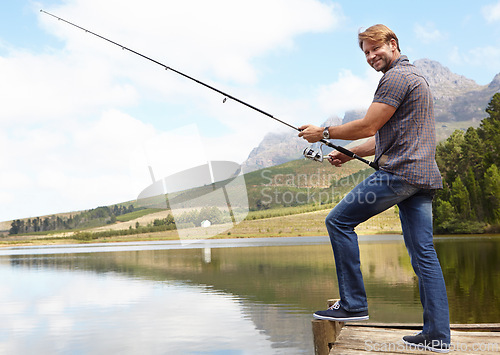 Image of Fishing, pole and portrait of mature man in nature for travel, or stress relief at lake on vacation, holiday or trip. Fish, line and person at outdoor river for water, adventure or peace in a forest