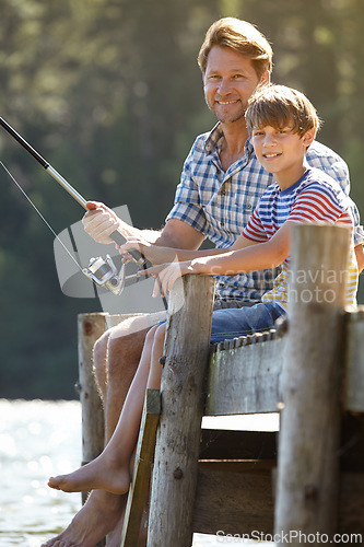 Image of Lake, fishing or pole by father and son portrait in nature bonding, vacation or travel adventure. Fishing, love and kid with dad at river for learning, teaching or sustainable living while camping