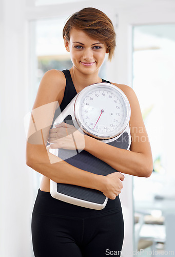 Image of Fitness, portrait or happy woman in home with scale for body training or gym workout to lose weight. Wellness, monitor or confident female sports athlete in health club for exercise progress results