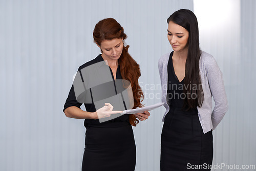 Image of Women, paper or pointing of startup, business or administration to explain project tasks in office. Businesswomen, document or show as discussion, collaboration or guidance for professional work