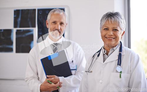 Image of Doctor, checklist and portrait in hospital with teamwork for xray results, medical advice and support. Healthcare, radiology and mature employees with collaboration for report, consultation or review