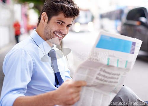 Image of Smile, businessman and reading newspaper for information, daily news and updates on local events. Professional, male person and outdoor with article for knowledge, stories and newsletter in city