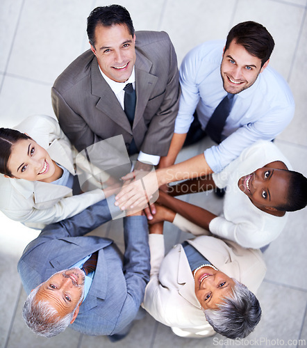 Image of Business people, portrait and team huddle for hands, community and support or unity. Colleagues, diversity and agreement in collaboration or alliance at work, solidarity and cooperation in office