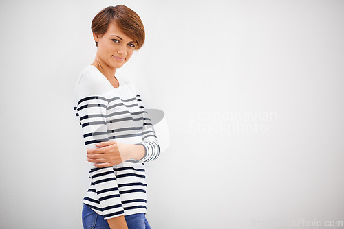 Image of Woman, portrait and smile in studio on mockup with casual fashion, confidence and relax on white background. Model, person and happiness on face with trendy clothes, cool outfit and calm attitude