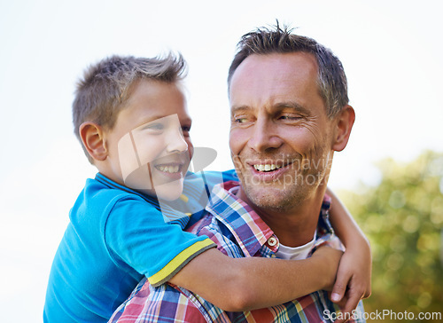 Image of Piggyback, happiness and dad with kid to play outdoors for bonding, love and support in garden for fathers day. Parent, son and together with care for summer fun in backyard with shoulder game