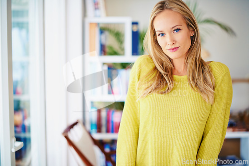 Image of Portrait, calm and woman in a home library for weekend reading, relax or stress relief in house. Book shelf, face and female person in study room for me time, novel or chilling on weekend or day off