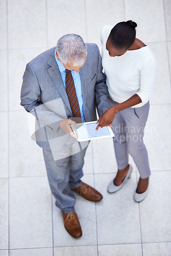 Image of Ceo, business woman and planning with tablet in office for internet, email and planning for meeting. Manager, assistant and teamwork with diversity from above view in corporate career in banking