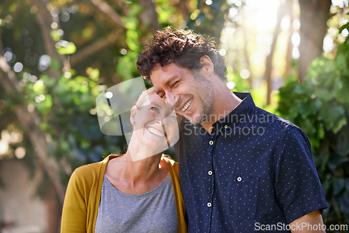 Image of Love, laugh and happy couple hug in park for fun, bonding or vacation together in nature. Travel, comic and funny people embrace in forest with care, trust or support, joke or fresh air in Australia