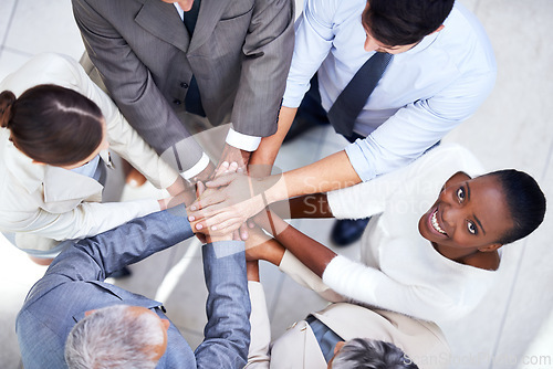 Image of Business people, team and huddle for hands in pile, community and support or unity. Colleagues, portrait and agreement in collaboration or alliance in workplace, solidarity and above for cooperation