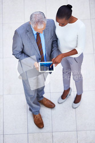 Image of Businessman, black woman and employees with tablet in office for internet, email and planning for business meeting. Manager, assistant and team with diversity from above view with digital pad