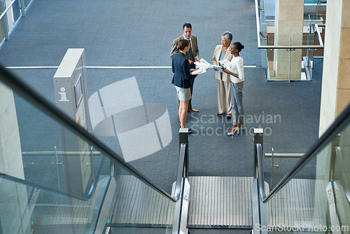 Image of Teamwork, group or business people in meeting for report, agenda discussion or portfolio in workplace. Project, documents and workers planning in office talking, conversation or speaking of paperwork