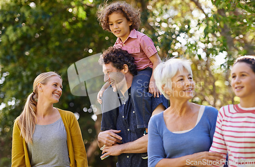 Image of Family, grandparent and fun in nature, happy and bonding children smile in park and walking. Parents, kid on shoulder and holding while talking, generations together and summer outside with trees