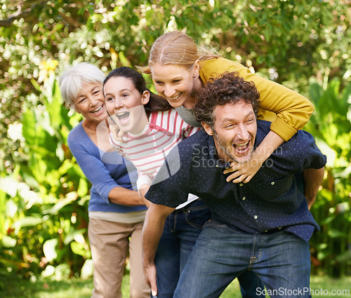 Image of Family, fun and playing in outdoor nature, love and bonding together or happy in backyard. Generations, smile and laugh or game for humor in garden or park, vacation and summer holiday in France