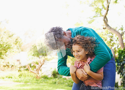 Image of Child, man or hug to relax in park, idea or memory of interracial adoption as fun, play or bonding. Boy, dad or smile in thinking of trust, support or together in happy hangout in sunny garden