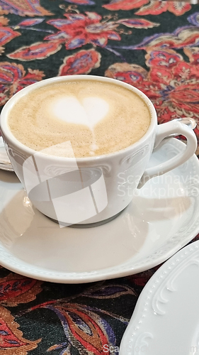 Image of A cup of cappuccino on a saucer