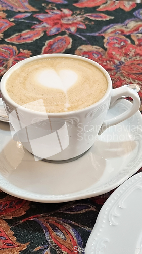 Image of A cup of cappuccino on a saucer