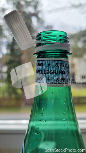 Image of TALLINN, ESTONIA - MAY 12, 2024: Close-up of San Pellegrino bottle with cap slightly open. European Union directive aimed at reducing plastic waste