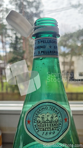 Image of TALLINN, ESTONIA - MAY 12, 2024: Close-up of an open San Pellegrino bottle in daylight. European Union directive aimed at reducing plastic waste