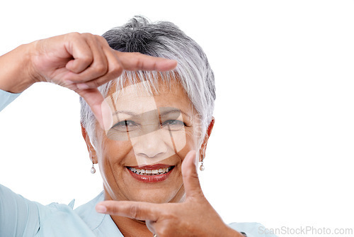 Image of Portrait, finger frame and senior woman with gesture, happiness and model isolated on a white studio background. Face, mature person and pensioner with mockup space and hands with confidence