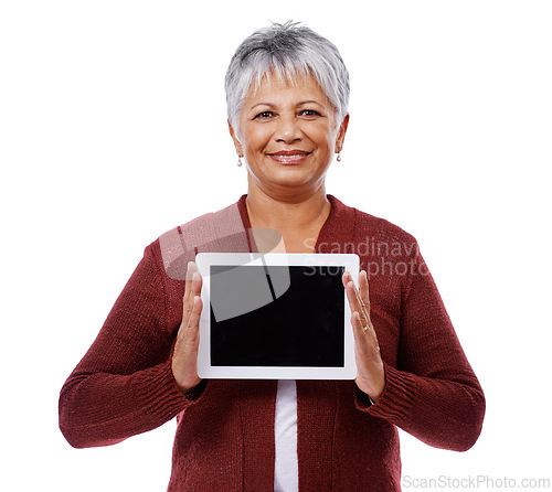 Image of Portrait, senior woman and tablet with screen, promotion and model isolated on a white studio background. Face, pensioner and old lady with technology and mockup space with opportunity and showing