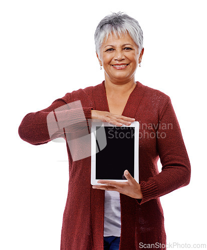 Image of Portrait, mature woman and tablet with screen, smile and model isolated on a white studio background. Face, pensioner and senior lady with tech, promotion or mockup space with opportunity and showing