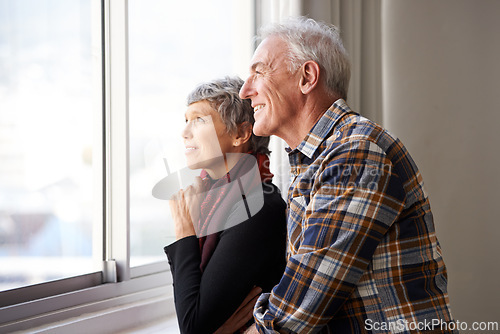 Image of Mature couple, man and woman in window of house, home and retirement holiday with happiness. Smile, elderly people and marriage for bonding, commitment and love in vacation for female and male person