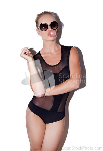 Image of Sunglasses, fashion and woman with bubblegum in studio isolated on a white background. Confidence, portrait and person blowing gum or candy with stylish model in leotard on a backdrop in Switzerland