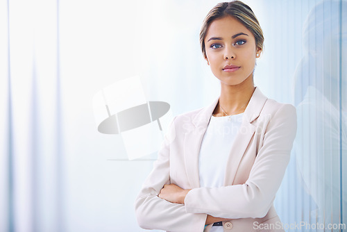 Image of Business woman, arms crossed and confident in portrait, paralegal at law firm and serious with pride. Young professional, career and legal expert at office with mockup space and corporate job