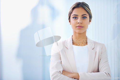 Image of Business woman, arms crossed and serious in portrait, paralegal at law firm and confidence with pride. Young professional, career and legal expert at office with mockup space and corporate job