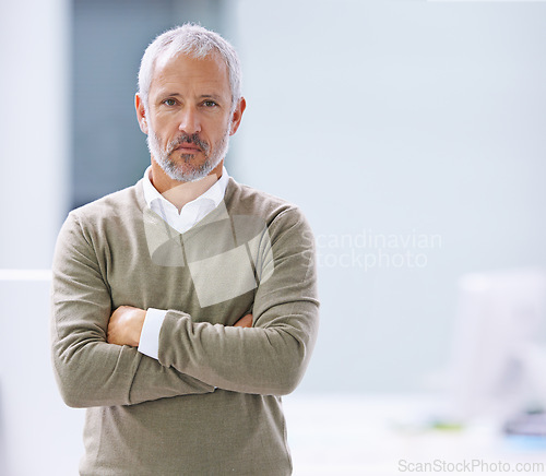 Image of CEO, portrait and confident businessman with arms crossed in office, startup company or creative agency. Designer, entrepreneur and face of mature man for professional, career or management