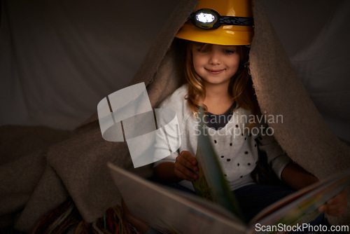 Image of Happy child, bedroom and reading book at night with flashlight for learning, education and imagination. Girl or kid in blanket at home for story, creative and fantasy with adventure alone in dark