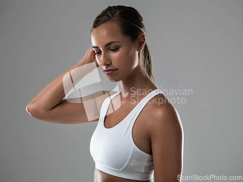 Image of Woman, fitness and wellness with health in studio, strong body with muscle and workout on grey background. Personal trainer, athlete for sports and exercise with pride and power, active and endurance