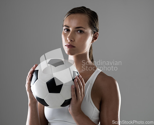 Image of Woman, portrait and athlete with soccer ball for match, game or kick off on a gray studio background. Female person or football player ready for sports exercise, workout or training on mockup space