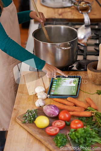 Image of Chef, cooking and tablet with vegetables in kitchen as nutrition meal or online recipe, screen or website. Person, home and raw ingredients with ux internet search for vegan eating, prepare or hungry