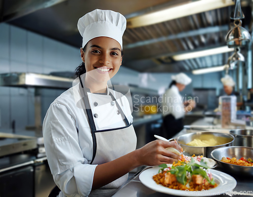 Image of female chef in a commercial kitchen