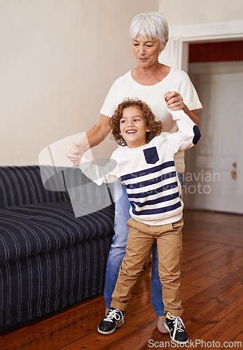 Image of Grandmother, child and play in happy home, family fun with kid for children development. Walking, dance and happiness with elderly person and grandchild together, living room and bonding on holiday