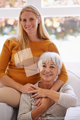 Image of Senior mother, daughter and home with smile on sofa for bonding to relax, visit and break together. Portrait, parent and mom with happiness in living room for love, hug and satisfied as family.