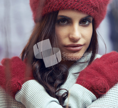 Image of Fashion, beauty and portrait of woman with winter clothes on cold weather vacation or holiday. Serious, makeup and face of female person with gloves and beanie for trendy style for weekend trip.