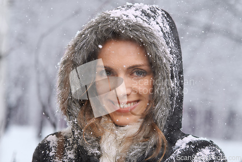 Image of Woman, portrait and nature with snow, winter season with fur coat for fashion, good mood and outdoor in forest. Peace, calm and cold with comfort in jacket for weather, ice or frozen with travel