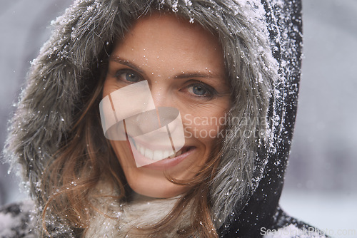 Image of Happy woman, portrait and nature with snow, winter season and fur coat for fashion, good mood and outdoor in forest. Peace, calm and cold with comfort in jacket for weather, ice or frozen with travel