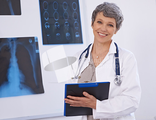 Image of Doctor, woman and portrait with clipboard, radiology for surgery with anatomy scan and healthcare. Senior medical professional, treatment and surgeon in room for xray, checklist and confident expert