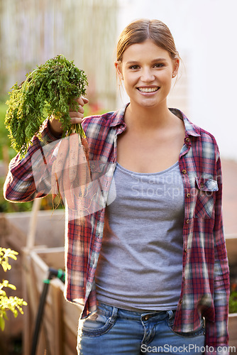 Image of Happy woman, portrait and farmer with carrots in harvest, garden or farm for crops or resources. Female person with smile and a bunch of roots for organic vegetables, natural growth or sustainability