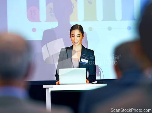 Image of Business woman, podium and presentation with projector screen, conference or workshop with laptop for slideshow. Corporate training, seminar and speaker with info, audience and professional speech