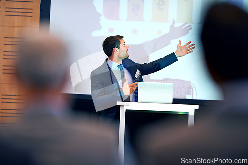 Image of Business man, presentation and pointing at projector screen, conference or workshop with laptop for slideshow. Corporate training, seminar and speaker with info, audience and professional speech