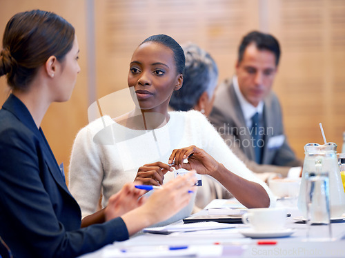 Image of Woman, meeting and discussion with team in conference for planning, strategy or collaboration at the office. Female person, employees or colleagues talking in boardroom conversation at the workplace