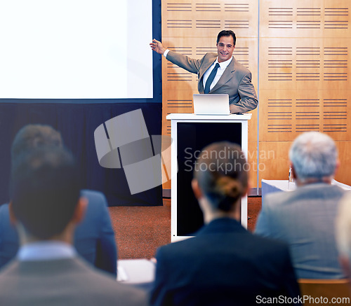 Image of Conference, speaker and man talking in meeting for business for discussion of stock market. Directors, women and people listening as team of employees in corporate company with presentation.