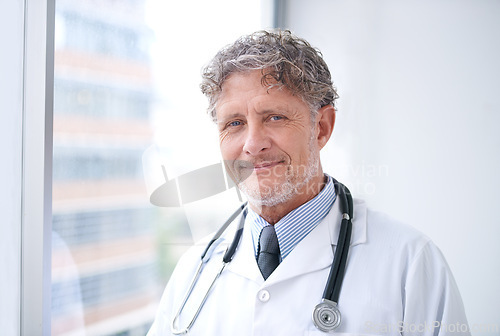 Image of Senior man, doctor and smile portrait in office for healthcare, medical support and medicine career with stethoscope. Mature, face and health expert with confidence and happy for cardiology in clinic