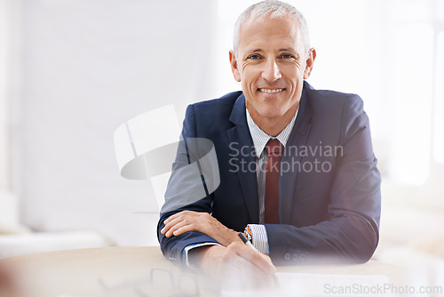 Image of Office, confident and portrait of business man with smile for career, job and working at desk. Professional, startup agency and senior person with documents for company pride, face and planning